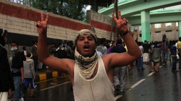 http://freedomwat.ch/wp-content/uploads/2012/09/A-Yemeni-protester-flashes-V-sign-for-victory-during-a-confrontation-with-riot-police-outside-the-US-embassy-in-Sanaa-on-September-13.-AFP-Photo1.jpe