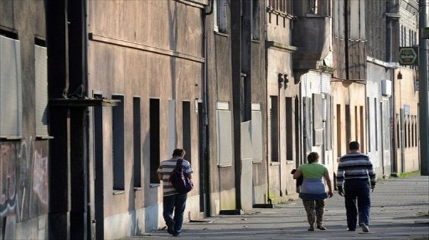 http://freedomwat.ch/wp-content/uploads/2012/09/Inhabitants-walk-by-empty-houses-in-the-western-German-city-of-Duisburg-Bruckhausen-in-the-Ruhr-region-file-photo-via-AFP1.jpg