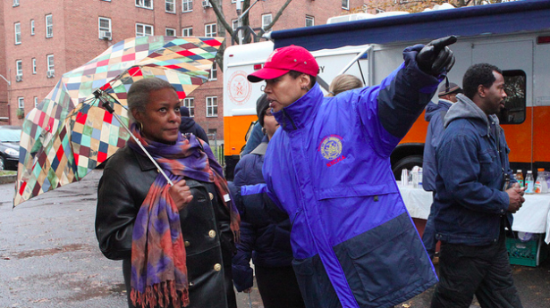 http://freedomwat.ch/wp-content/uploads/2012/11/NYCHA-worker-helps-a-resident-of-Red-Hook-after-Sandy-615x3451.png